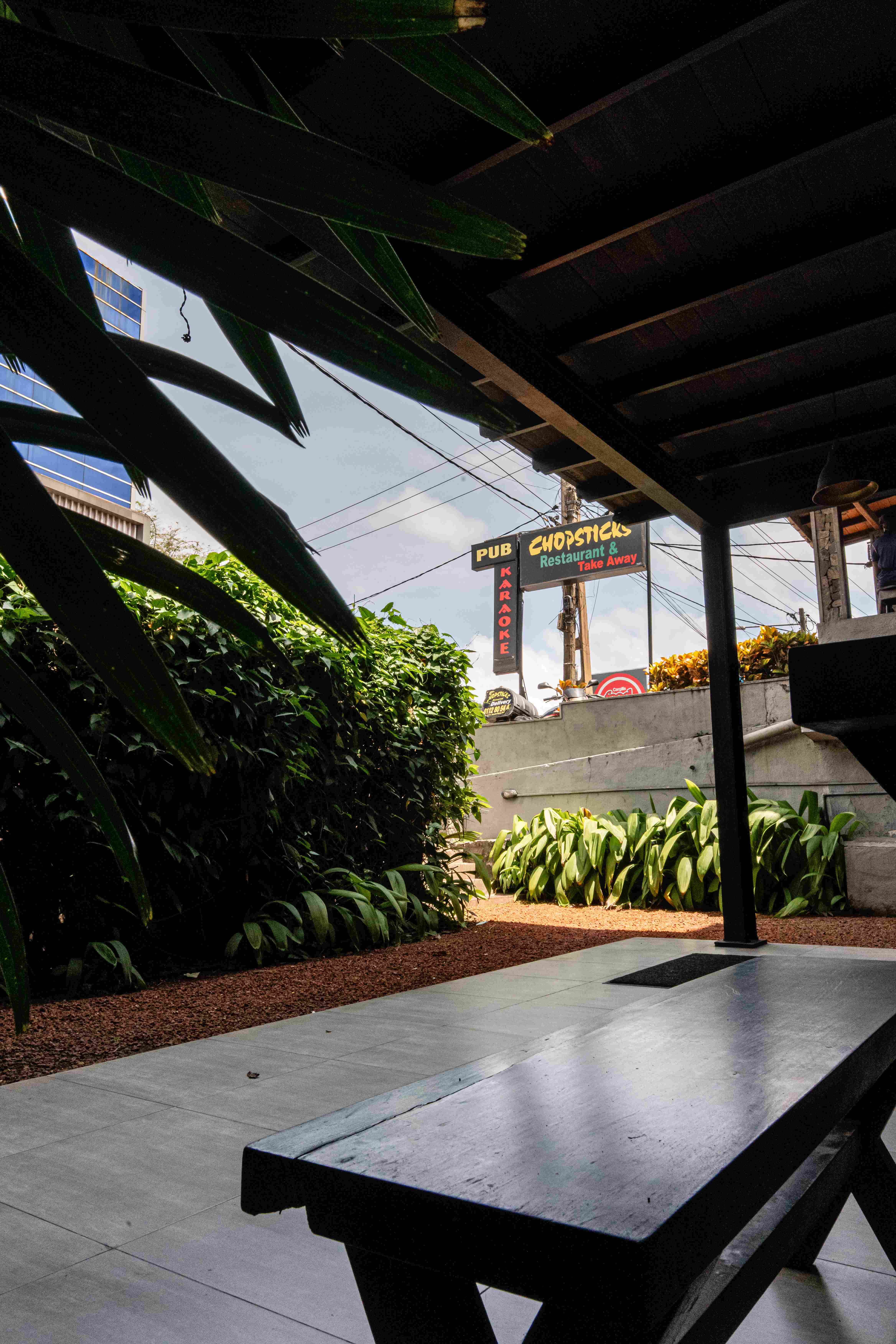 The Chopsticks courtyard and restaurant sign in Nawala